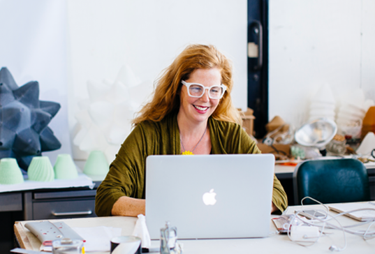 photo of a woman using a computer