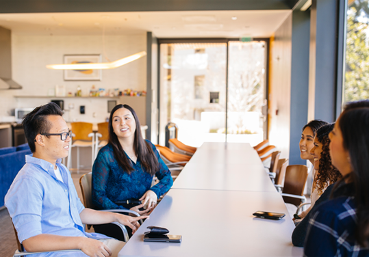 photo of people sitting at a table